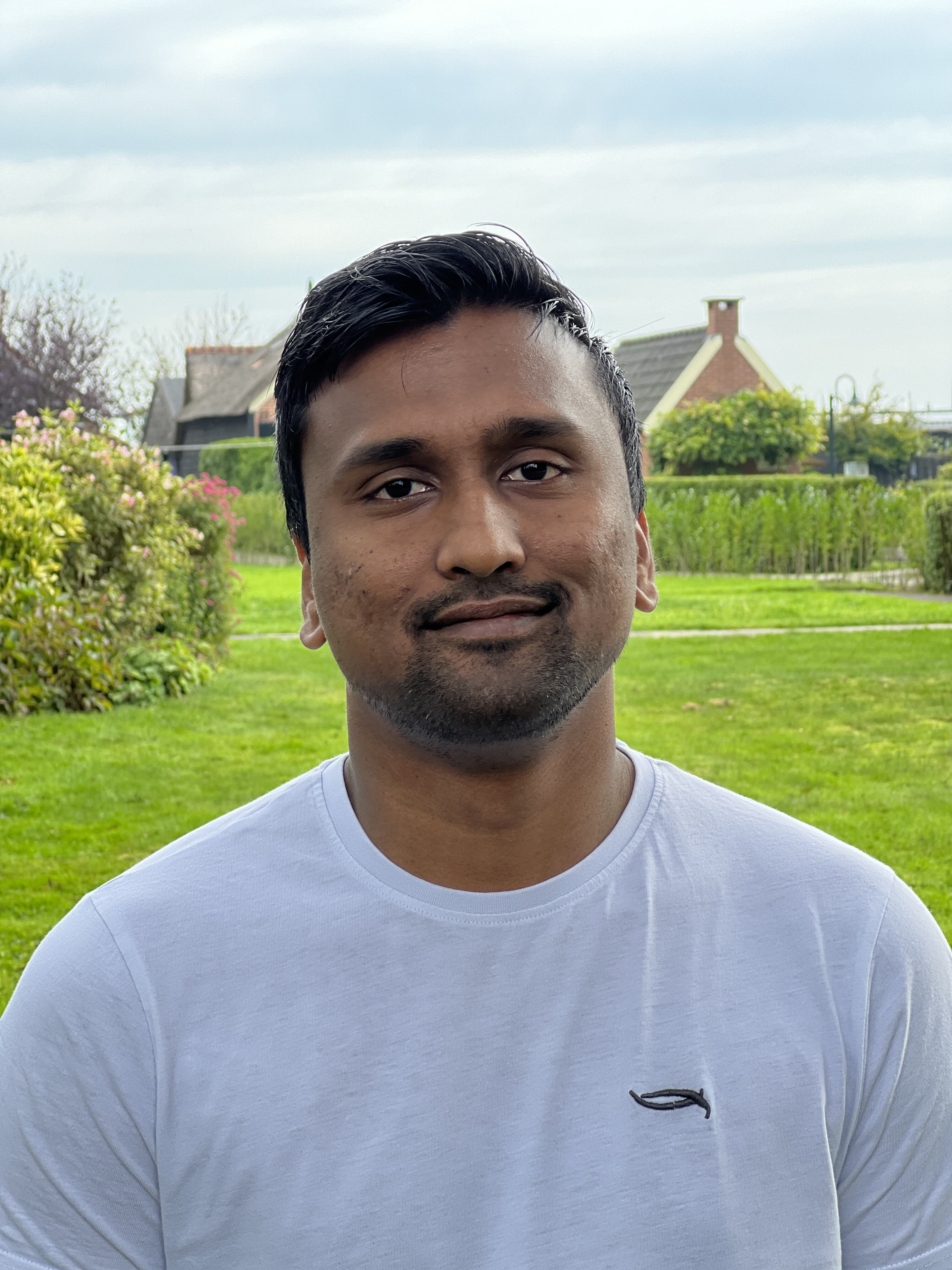 Author Murali sitting in a gathering